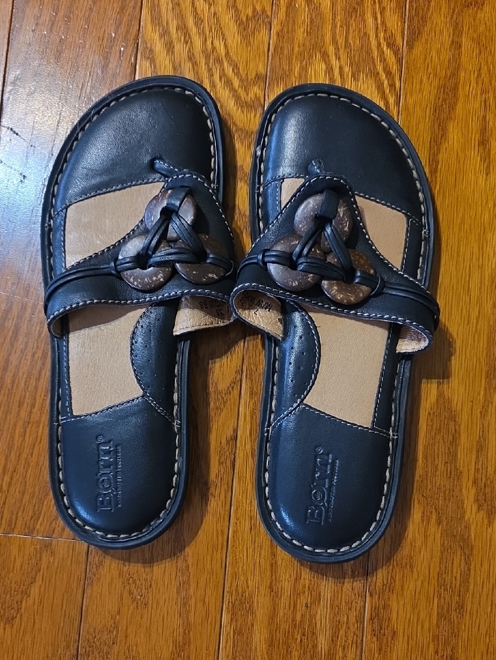 Born Black and Tan Leather Slide Sandals with Knot Accent